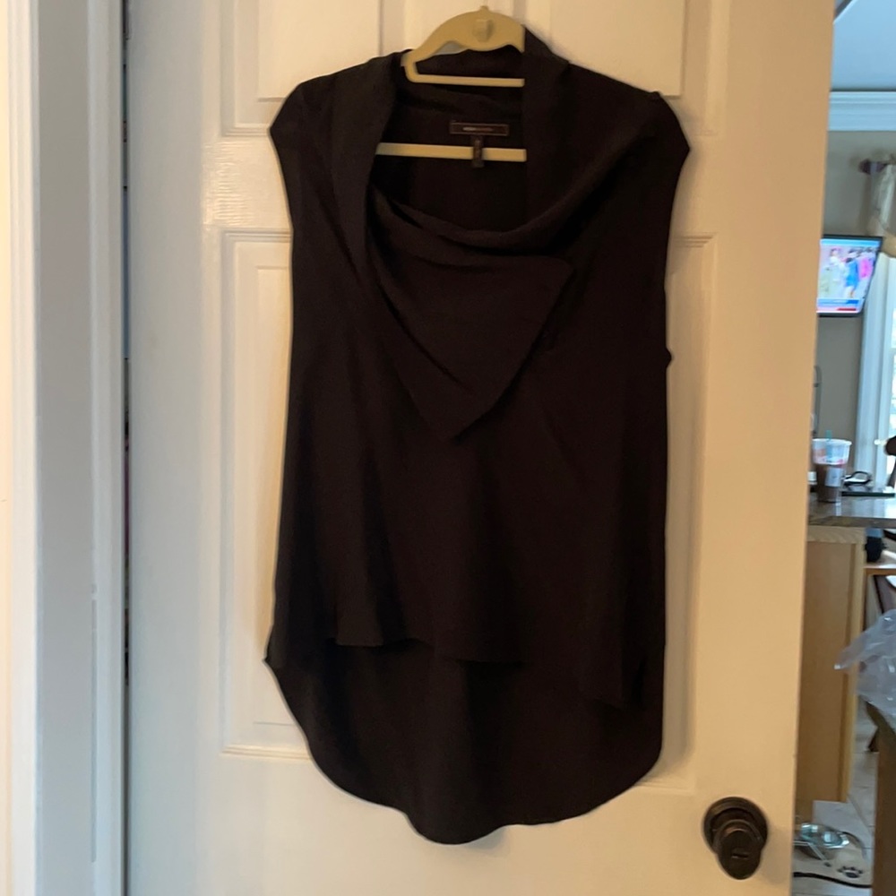 Black sleeveless. Pull over side button blouse.
